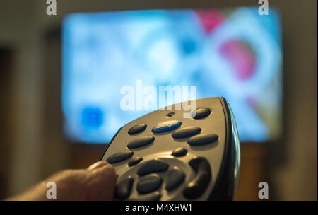 Close-up of a Sky TV remote control being used in a living room, United Kingdom. Stock Photo