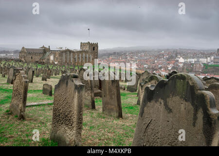 Whitby Yorkshire, view across St Mary Churchyard towards the Yorkshire coastal town of Whitby on a stormy winter day, England, UK. Stock Photo