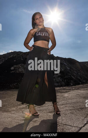 Young woman in black evening dress Stock Photo
