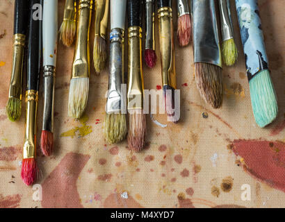 Paint palette with various acrylic paints and a brush Stock Photo - Alamy