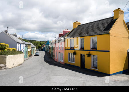 Bright pastel paintwork of its terraced houses in Eyeries village on the Beara Peninsula. Southern Ireland. Stock Photo