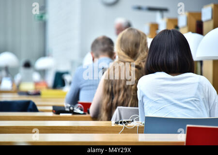 Students reading in a public library. Stock Photo