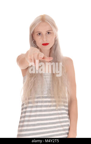 Serious woman pointing finger at camera Stock Photo