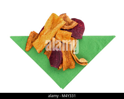 Vegetable crisp, chips. Bright snack on green napkin. Stock Photo