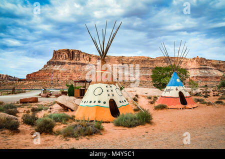 Two colorful hand-painted teepees at the entrance of Arches National Park in Maob, Utah remind visitors of the region's Native American heritage. Stock Photo