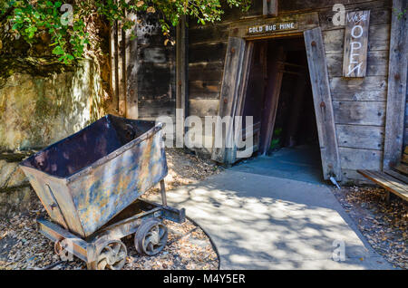 Cart used to haul gold at entrance of gold mine in Sacramento, CA. Stock Photo