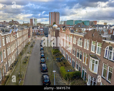 View of street with century old historic apartment houses in city of Groningen, Netherlands Stock Photo