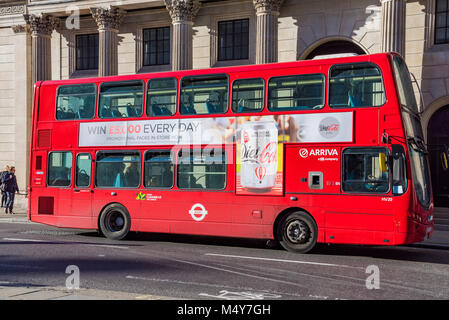 LONDON, UNITED KINGDOM - OCTOBER 25: Traditional red London bus outside the famous Bank of England building in the Bank financial district on October  Stock Photo
