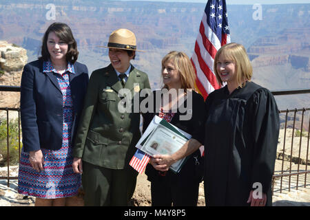 NPS Centennial Grand Canyon Naturalization Ceremony  U.S. Citizenship and Immigration Services (USCIS) teamed with Grand Canyon National Park and the National Park Service (NPS) to welcome 15 new United States citizens representing 12 countries. The ceremony took place August 25th, 2016, the National Park Service's 100th birthday, at 10 am at Mather Point Amphitheater. In honor of the NPS Centennial, USCIS has partnered with the NPS to hold more than 100 naturalization ceremonies on national park sites during 2016. Stock Photo