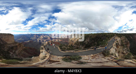 Maricopa Point is 0.7 miles (1.1 km) beyond First Trail View on Hermit Road (West Rim Drive) on the South Rim of the park, as rain clouds parted on July 25, 2017.    Hermit Road is a scenic route along the west end of Grand Canyon Village on the South Rim which follows the rim for 7 miles (11 km) out to Hermits Rest. This extremely popular route is accessed by free park shuttle bus, foot, bicycle, or commercial bus tour most of the year, with private vehicles allowed only during winter months.  Along the rim are nine designated viewpoints where the free Hermits Rest Route shuttle bus stops. Th Stock Photo