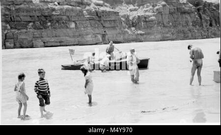 OTIS MARSTON RIVER EXPEDITION WITH FIVE MOTORBOATS PREPARING TO LEAVE FOR TRIP THROUGH GRAND CANYON FROM LEE'S FERRY WHERE THIS PHOTO WAS TAKEN.  PHOTOGRAPHER H.C. BRYANT.  CIRCA 1951.    Grand Canyon Nat Park Historic River Photo. Stock Photo
