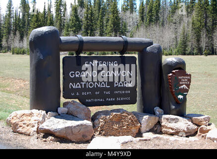 The new entrance sign is a replica of the original design. Work was completed in time for the 2012 season.  Grand Canyon National Park North Rim Entrance Sign . Stock Photo