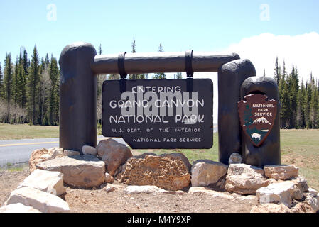 The new entrance sign is a replica of the original design. Work was completed in time for the 2012 season.  Grand Canyon National Park North Rim Entrance Sign . Stock Photo