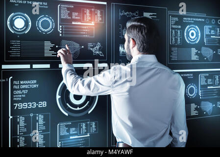 Clever programmer working with the new information while being alone Stock Photo