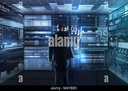 Calm skilled programmer working and using virtual reality glasses Stock Photo