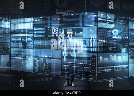 Attentive specialist looking concentrated while touching the futuristic screen Stock Photo