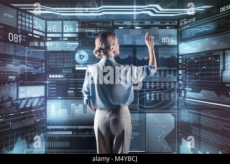 Experienced programmer working with the new information while being alone Stock Photo