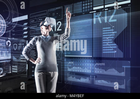 Emotional programmer feeling glad while noticing positive changes Stock Photo