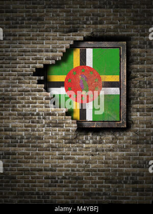 3d rendering of a  Dominica flag over a rusty metallic plate embebed on an old brick wall Stock Photo