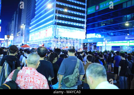 HONG KONG, OCT 1: protesters stand in silent tribute for 2012 Lamma ferry collision in Mongkok on 1 October 2014. after riot police fire tear shell in peaceful protest, more people join the protest Stock Photo