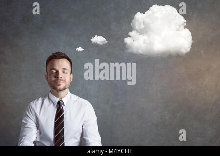 Relaxed and balanced man with a thought bubble Stock Photo