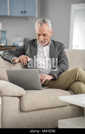 Cheerful bearded man having video call Stock Photo