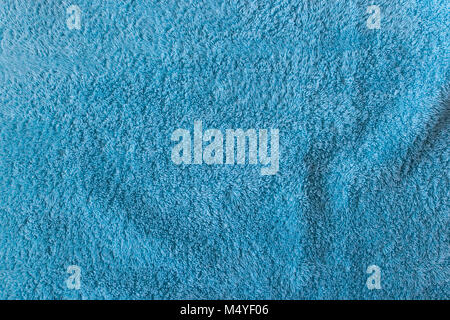 Close-up of soft turquoise towel texture background viewed from above. Stock Photo
