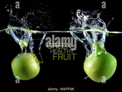 Apples with splash water and sample text in the blank made from fresh and healthy fruit concept in studio technic. Stock Photo