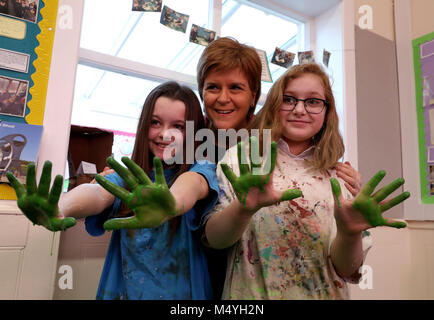 First Minister Nicola Sturgeon with pupils l-r Erin Clark and Charlie McGregor during a visit to Levenvale Primary School in Alexandria, West Dunbartonshire, to see some of the work being carried out as part of the Scottish Government's Pupil Equity Fund. Stock Photo