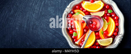 Alcoholic cocktail with pieces of fruit and berries in a bowl.Alcoholic concept Stock Photo