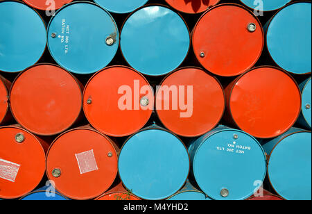 colorful of old oil tanks after uesd at outdoor junk place photo in sun lighting. Stock Photo