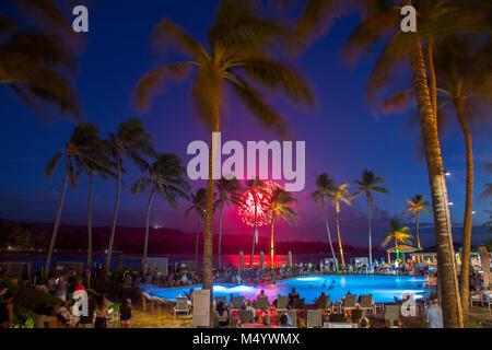 4th of July fireworks seen from tourist resort at Turtle Bay, north shore of Oahu, Hawaii Islands, USA Stock Photo