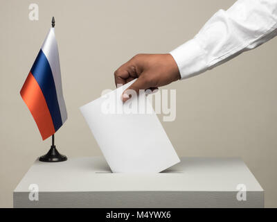 Ballot box with national flag of Russia. Presidential election in 2018. hand throwing a ballot Stock Photo