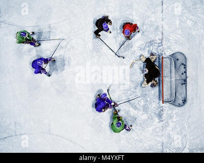 View from above of ice hockey players playing on rink Stock Photo