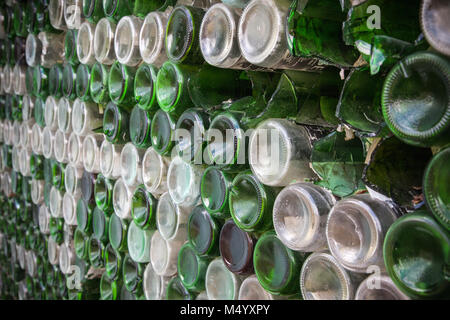Bottom of the bottle texture. Glass,Dirty empty wine bottles close-up,Bottom of green bottle pattern background. Stock Photo