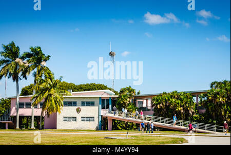 Pink and white building housing the Flamingo Visitor Center at Everglades National Park. Stock Photo