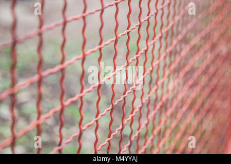 red Grid Steel Background, Metal Net Background, Metal Wire Texture And Background,Selective Focus of Mosquito Wire Screen . Stock Photo