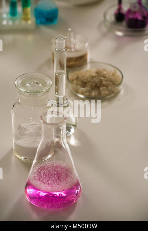 Group of laboratory flasks liquid on table Stock Photo