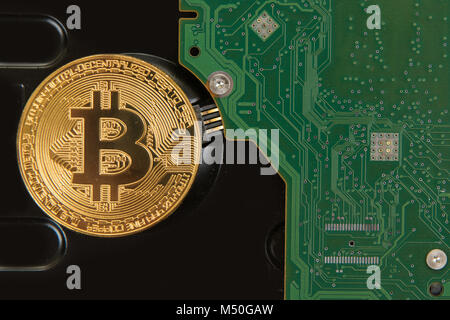 Bitcoin coin with HDD Stock Photo
