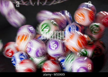 Colourful lottery balls in a machine Stock Photo