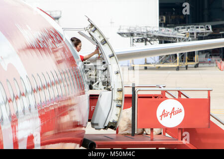 BANGKOK, THAILAND, NOV 10 2017, The stewardess closes the rear door of the plane. The cabin crew opens the entrance to the aircraft to the stairs read Stock Photo