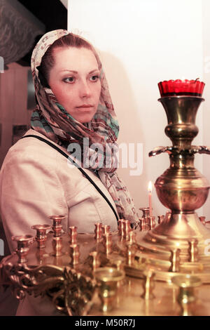Woman prays in the Russian church Stock Photo