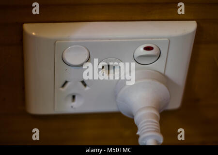 Plug inserted in Electrical socket Stock Photo