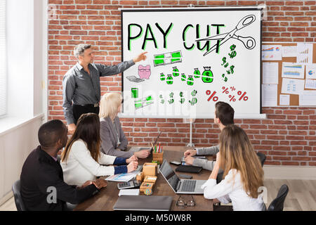 Man Giving Salary Paycut Presentation To Workers Stock Photo