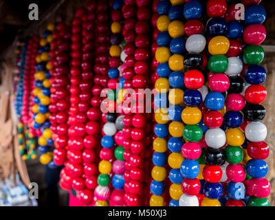 Set of colourful beads on a fence for Mardi Gras,New Orleans, Louisiana, USA.Carnival time collection, craft, creative Stock Photo