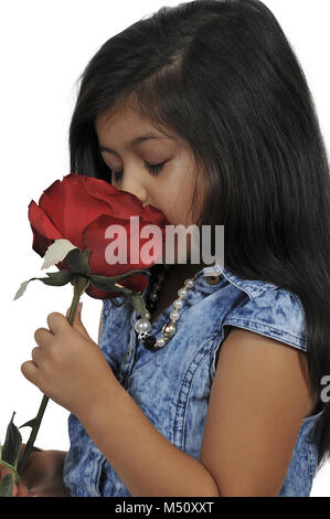 Little Girl Holding Rose Stock Photo