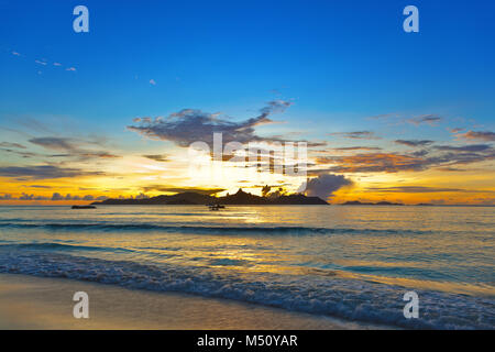 Sunset on tropical beach - Seychelles Stock Photo