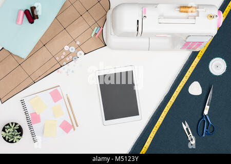 digital tablet and tailoring items Stock Photo