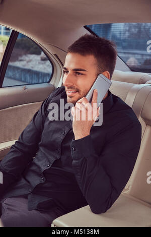 A handsome businessman in luxury car Stock Photo