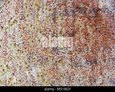 Background with brown paint flaking off a wall Stock Photo